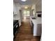 Open kitchen with stainless steel appliances, white cabinets, and stone countertops at 136 Walkers Pond Dr, Villa Rica, GA 30180