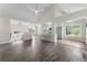 Expansive living room featuring vaulted ceilings, hardwood floors, and views of the front entrance at 136 Walkers Pond Dr, Villa Rica, GA 30180