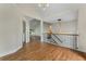 Bright foyer featuring hardwood floors, elegant lighting, and an open floor plan with staircase at 136 Walkers Pond Dr, Villa Rica, GA 30180