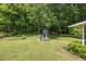Expansive backyard featuring lush lawn, play area, and garden, perfect for outdoor living at 1732 Samaria Trl, Tucker, GA 30084