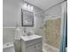 Bathroom with tile shower and modern sink vanity, and neutral decor at 1732 Samaria Trl, Tucker, GA 30084