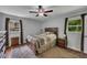 Relaxing bedroom with ample natural light, a ceiling fan, and neutral decor at 1732 Samaria Trl, Tucker, GA 30084