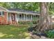Charming front porch with white railings and a well-maintained garden at 1732 Samaria Trl, Tucker, GA 30084