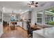 Open kitchen featuring gray cabinets, stainless steel appliances, butcher block, and a cozy desk area at 1732 Samaria Trl, Tucker, GA 30084