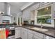 Updated kitchen with modern appliances, solid countertops, and an open view of the living space at 1732 Samaria Trl, Tucker, GA 30084