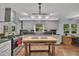 Bright kitchen with gray cabinetry, an island with wooden base, and updated appliances at 1732 Samaria Trl, Tucker, GA 30084