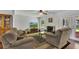 Comfortable living room with a fireplace, a large TV, and a view of the backyard at 1732 Samaria Trl, Tucker, GA 30084