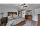 Spacious main bedroom features a ceiling fan and plenty of closet space with a door to the bathroom at 1732 Samaria Trl, Tucker, GA 30084