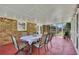 Screened patio, perfect for outdoor dining, connects to the backyard via brick steps at 1732 Samaria Trl, Tucker, GA 30084