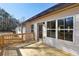 Side view of the new wooden deck with door access to the house and windows looking to the backyard at 3279 Greenhill Dr, Villa Rica, GA 30180