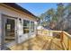 Lovely outdoor space with a new wooden deck, side door access, and a glimpse of the wooded backyard at 3279 Greenhill Dr, Villa Rica, GA 30180