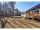 Large backyard offers plenty of room for outdoor activities with newly built deck and wooded views at 3279 Greenhill Dr, Villa Rica, GA 30180