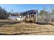 Backyard view with deck extending off of the house; perfect for outdoor enjoyment at 3279 Greenhill Dr, Villa Rica, GA 30180