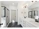 Elegant bathroom boasts a modern design with marble accents, dual sinks, and sleek black fixtures at 3279 Greenhill Dr, Villa Rica, GA 30180