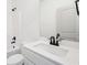 Bright bathroom featuring a shower-tub combo with a white vanity and black fixtures at 3279 Greenhill Dr, Villa Rica, GA 30180