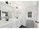 Bathroom with double vanity, soaking tub, and walk-in shower with matte black hardware at 3279 Greenhill Dr, Villa Rica, GA 30180