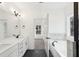 Bathroom featuring double vanity, soaking tub, tiled shower, and black matte fixtures at 3279 Greenhill Dr, Villa Rica, GA 30180