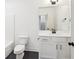 Bright bathroom featuring white cabinets, modern fixtures, and a sleek mirror at 3279 Greenhill Dr, Villa Rica, GA 30180