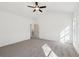 Spacious bedroom with modern fan and natural light showcases access to other parts of home at 3279 Greenhill Dr, Villa Rica, GA 30180