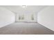 Bright bedroom with neutral carpet, white walls and natural light from two windows at 3279 Greenhill Dr, Villa Rica, GA 30180