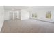 Bright bedroom with neutral carpet, white walls and natural light from two windows at 3279 Greenhill Dr, Villa Rica, GA 30180