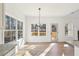 Dining area with large windows, a chandelier, and access to the back deck at 3279 Greenhill Dr, Villa Rica, GA 30180