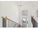 Bright entryway with wood floors, an open staircase, and a view into the adjacent living area at 3279 Greenhill Dr, Villa Rica, GA 30180