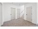 Hallway with neutral carpet, white walls and white doors that provide access to various rooms at 3279 Greenhill Dr, Villa Rica, GA 30180
