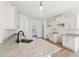 Bright kitchen features white cabinets, granite countertops, modern appliances, and stylish backsplash at 3279 Greenhill Dr, Villa Rica, GA 30180