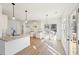 Modern kitchen with island, granite countertops, stainless steel appliances, and breakfast area with access to outdoor deck at 3279 Greenhill Dr, Villa Rica, GA 30180