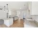 Bright kitchen with island, white cabinets, granite countertops and modern lighting fixtures at 3279 Greenhill Dr, Villa Rica, GA 30180