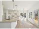 Modern kitchen features granite countertops, stainless steel appliances, and breakfast area leading to an outdoor deck at 3279 Greenhill Dr, Villa Rica, GA 30180