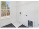 Bright laundry room with a large window, and modern hookups for appliances at 3279 Greenhill Dr, Villa Rica, GA 30180