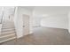 Expansive living room with neutral carpet, white walls and natural light from large windows at 3279 Greenhill Dr, Villa Rica, GA 30180