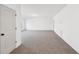 Spacious living room with neutral carpet, white walls and a view out the window at 3279 Greenhill Dr, Villa Rica, GA 30180