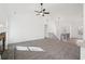 Expansive living room with vaulted ceilings and fireplace is carpeted, creating a cozy and inviting atmosphere at 3279 Greenhill Dr, Villa Rica, GA 30180