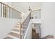 Bright staircase with wood floors, an open staircase, and a view into the open floorplan at 3279 Greenhill Dr, Villa Rica, GA 30180