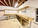 Unfinished basement space with wooden workbenches and pegboard walls at 342 Mccurry Rd, Stockbridge, GA 30281