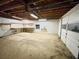 Spacious unfinished basement with workbench and garage door at 342 Mccurry Rd, Stockbridge, GA 30281