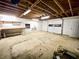Unfinished basement with exposed ceiling and storage shelving at 342 Mccurry Rd, Stockbridge, GA 30281