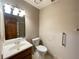 Bathroom featuring a white sink, vanity, toilet, and a large mirror above the sink at 342 Mccurry Rd, Stockbridge, GA 30281