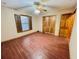 Bedroom featuring wood floors, a ceiling fan, a window, and a closet at 342 Mccurry Rd, Stockbridge, GA 30281