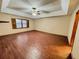 Spacious bedroom featuring wood-look floors, a ceiling fan, and natural light from the large window at 342 Mccurry Rd, Stockbridge, GA 30281