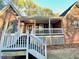 Exterior showcasing the covered porch, brick facade, and white railing at 342 Mccurry Rd, Stockbridge, GA 30281