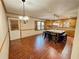 Eat-in kitchen area features a large island with seating and wood floors at 342 Mccurry Rd, Stockbridge, GA 30281