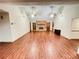 Open concept living room with hardwood flooring, brick fireplace and vaulted ceiling at 342 Mccurry Rd, Stockbridge, GA 30281