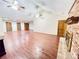 Large living area featuring a brick fireplace, vaulted ceiling, and wood-look flooring at 342 Mccurry Rd, Stockbridge, GA 30281
