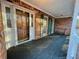 Covered front porch with stained wood door, green shutters, and a built-in bench at 342 Mccurry Rd, Stockbridge, GA 30281