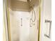 Shower with chrome and gold fittings, white subway tile, and glass door at 342 Mccurry Rd, Stockbridge, GA 30281