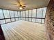 Sunroom features a wood deck, ceiling fan, and screened windows at 342 Mccurry Rd, Stockbridge, GA 30281